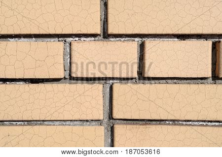 A Wall Of Cracked Bricks With Fresh Cement Joints Closeup