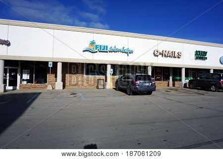 BAY VIEW, MICHIGAN / UNITED STATES - NOVEMBER 26, 2016: One may have one's hair cut and one's skin tanned at the Fiji Salon and Spa, and have one's nails trimmed at Q-Nails, in Bay View.