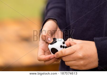 Quito, Ecuador - February 10, 2017 Fidget Cube stress reliever manipulated