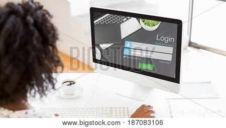 Digital composite of Businesswoman using log in page on computer