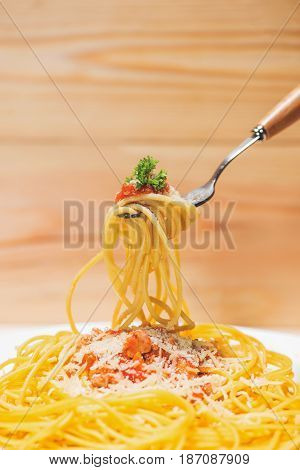 Close-up Of Asta Spaghetti With Tomato Sauce, Olives And Garnish. Italian Food.