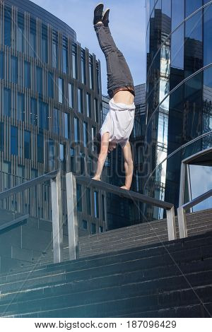 Young Man Doing Handstand In The City