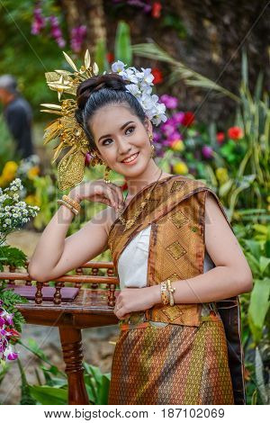 NAKORN PHANOM THAILAND - FEBRUARY 14 2015: Thai northeastern Phutai dancer with traditional costume in Phutai world event day in Renunakorn of Nakorn Phanom Thailand.