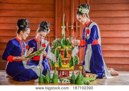 NAKORN PHANOM THAILAND - FEBRUARY 14 2015: Thai northeastern Phutai traditional liftstyle in making rice offering and garland for Phutai world cerebration event in Renunakorn of Nakorn Phanom Thailand.
