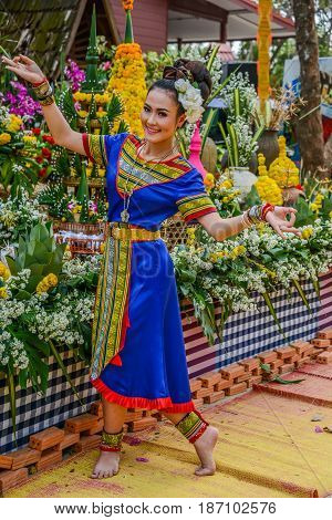 NAKORN PHANOM THAILAND - FEBRUARY 14 2015: Thai northeastern Phutai dancer with traditional costume in Phutai world event day in Renunakorn of Nakorn Phanom Thailand.