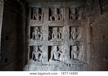 Ellora Caves UNESCO World Heritage Site. Statue of big Buddha sanctuaries devoted to Buddhism Hinduism and Jainism. Temples and monasteries near Aurangabad.