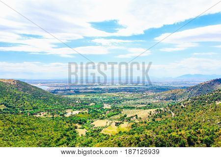 Natural landscape with mountains, groves, green forest and valley. Panoramic view of Mediterranean nature, Girona, Catalonia, Spain.