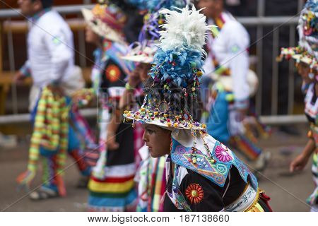 ORURO, BOLIVIA - FEBRUARY 26, 2017: Tinkus dance group in ornate costumes performing as they parade through the mining city of Oruro on the Altiplano of Bolivia during the annual carnival.