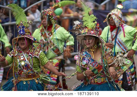 ORURO, BOLIVIA - FEBRUARY 26, 2017: Tinkus dance group in ornate costumes performing as they parade through the mining city of Oruro on the Altiplano of Bolivia during the annual carnival.
