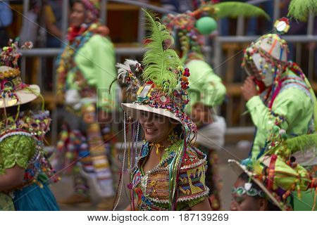 ORURO, BOLIVIA - FEBRUARY 26, 2017: Tinkus dance group in ornate costumes performing as they parade through the mining city of Oruro on the Altiplano of Bolivia during the annual carnival.