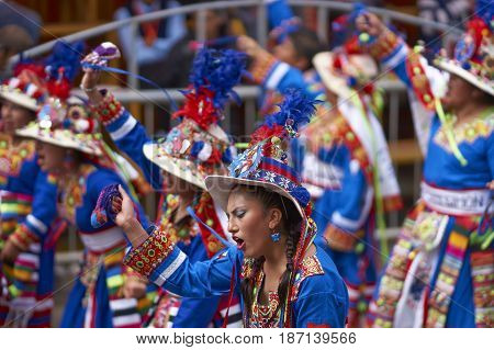 ORURO, BOLIVIA - FEBRUARY 26, 2017: Tinkus dance group in ornate costumes performing as they parade through the mining city of Oruro on the Altiplano of Bolivia during the annual carnival.
