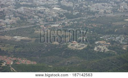 Beautiful village in a valley surrounded by green trees