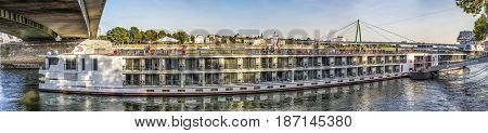 Skyline Of Cologne With River Rhine In Late Afternoon And Cruise Ship