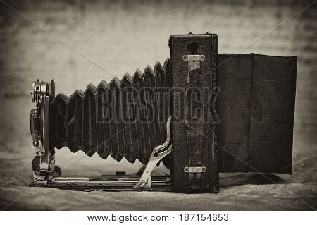 vintage camera with bellows. Retro style. Sepia toning