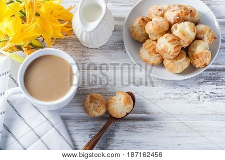 Coffee And Eclairs On A White Background