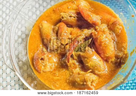 Orange coloured Prawns cooked and served in a bowl Indian delicacy food - called "Galda Chingri" in local Bengali Language. India is famous for spicy food in the world. Tourists visit India for it's tasty foods.