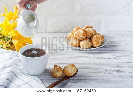 Coffee And Eclairs On A White Background