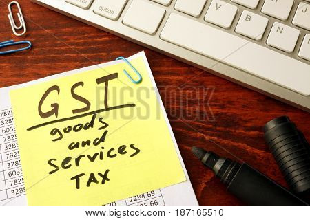 Notepad with word GST Goods and services tax.