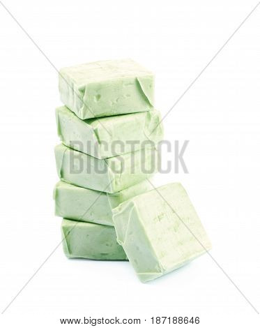 Pile of fruit flavoured chewing candies isolated over the white background