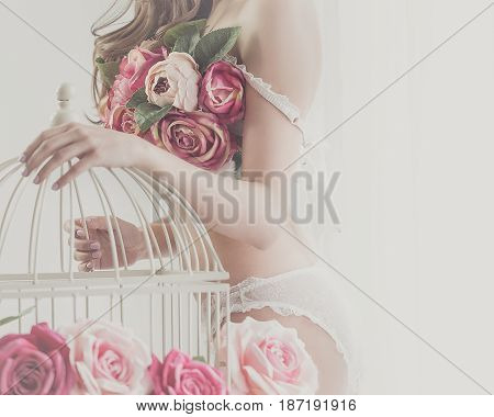 Lovely girl in underwear. Bra of flowers. Spring mood. Soft focus. Man is unrecognizable