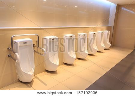 Clean Toilet urine sink row. New modern Toilet bowl in Hotel bathroom.
