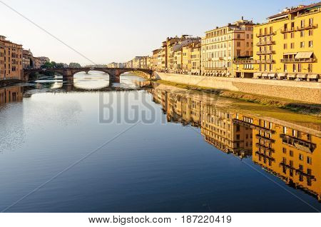 Santa Trinita bridge and Acciaiuoli embankment (Lungarno) in the late afternoon sun - Florence Tuscany Italy