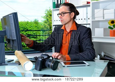 Business Man Behind His Desk In Summerly Hot Office