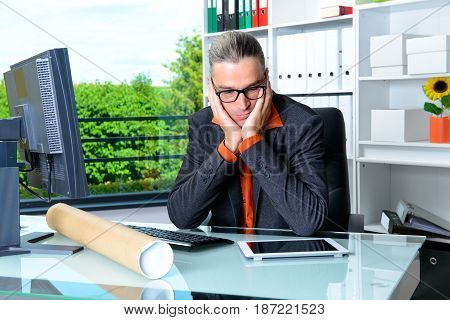 Business Man Behind His Desk In Summerly Hot Office