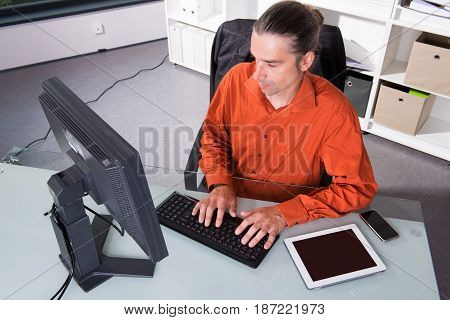Business Man Behind His Desk In Summerly Hot Office