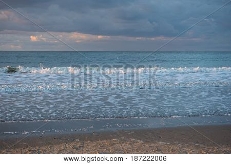 Catching thunderstorm over the North Sea beach of Cadzand Holland