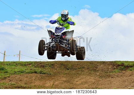 Unidentified Racer Rides A Quad Motorbike.