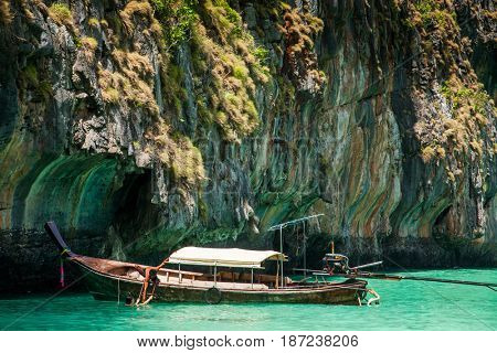 KO PHI PHI LEH, THAILAND, February 1, 2014: Traditional long tail boats on the beach of Maya Bay, Andaman Sea, famous tourist destination in the Ko Phi Phi achipelago