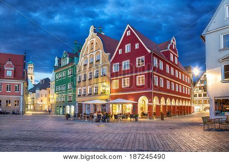Colorful buildings on Market square (Marktplatz) at dusk in Memmingen Bavaria Germany
