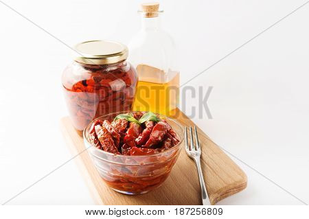 Italian Dish - Sundried Tomato With Oil And Spice On The Wooden Board