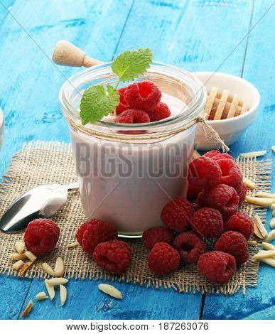 Beautiful Appetizer Pink Raspberries Fruit Smoothie Or Milk Shake In Glass Jar With Berries Backgrou