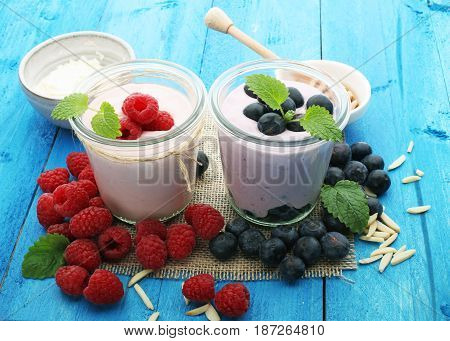 Beautiful Appetizer Pink Raspberries Fruit Smoothie Or Milk Shake In Glass Jar With Berries Backgrou