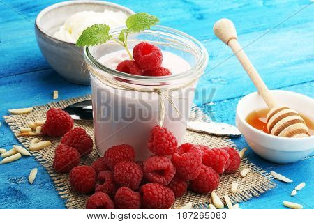 Beautiful Appetizer Pink Raspberries Fruit Smoothie Or Milk Shake In Glass Jar With Berries Backgrou
