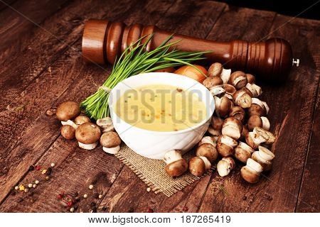 Creamy Mushroom Soup on brown wooden background