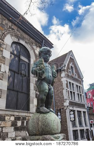 Bronze Sculpture Of A Boy Holding Two Fishes At Fischmarkt In Aachen