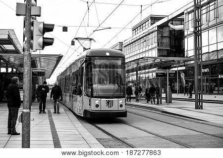 Dresden, Germany, December 19, 2016: The modern tramway in Dresden in Germany. Disembarkation of passengers at the railway station.