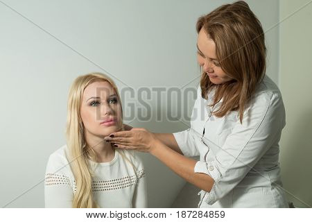 Beautiful young girl on examination with a doctor in a polyclinic