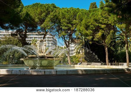 People Relaxing Near Fountain
