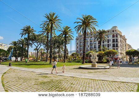 People Walking And Relaxing In Albert I Gardens