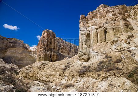 Rocks of a fantastic unusual shape and dry creek in the desert of Kazakhstan