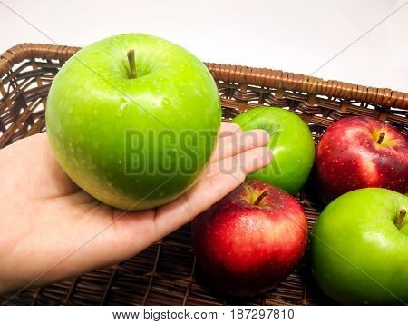Handing a Fresh Green Apple on the Palm
