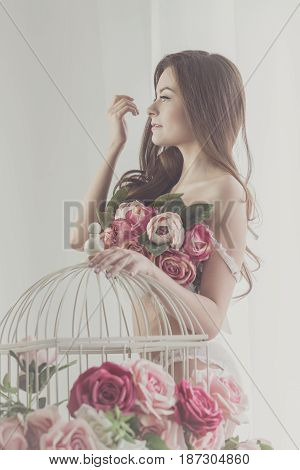 Sweet girl in her underwear flirts. Bra of flowers. Spring mood. Soft focus.