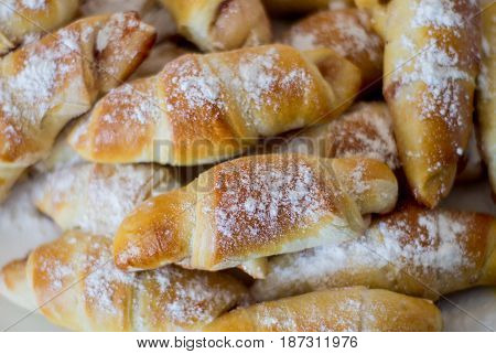Fresh baked bun with jam. Close up.