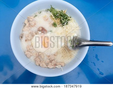Traditional Thai Porridge Rice Gruel In White Bowl, Congee. In The Street Night Market.