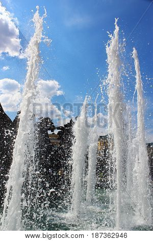 Beautiful and powerful jet fountain the Four seasons in the Alexander garden and Manezh square beating in the blue sky