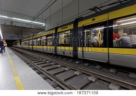 PORTO, PORTUGAL - MAY 8, 2017: People in the train on the central metro station Trindade. Metro do Porto is one of the largest light rail networks in Europe